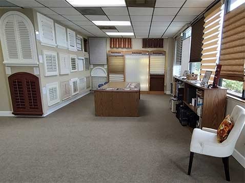 Store interior showcasing several different types of window coverings